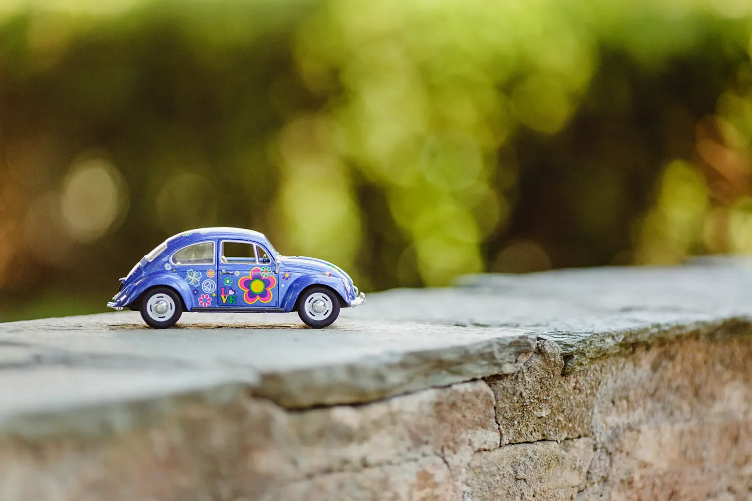 a toy car on a rock