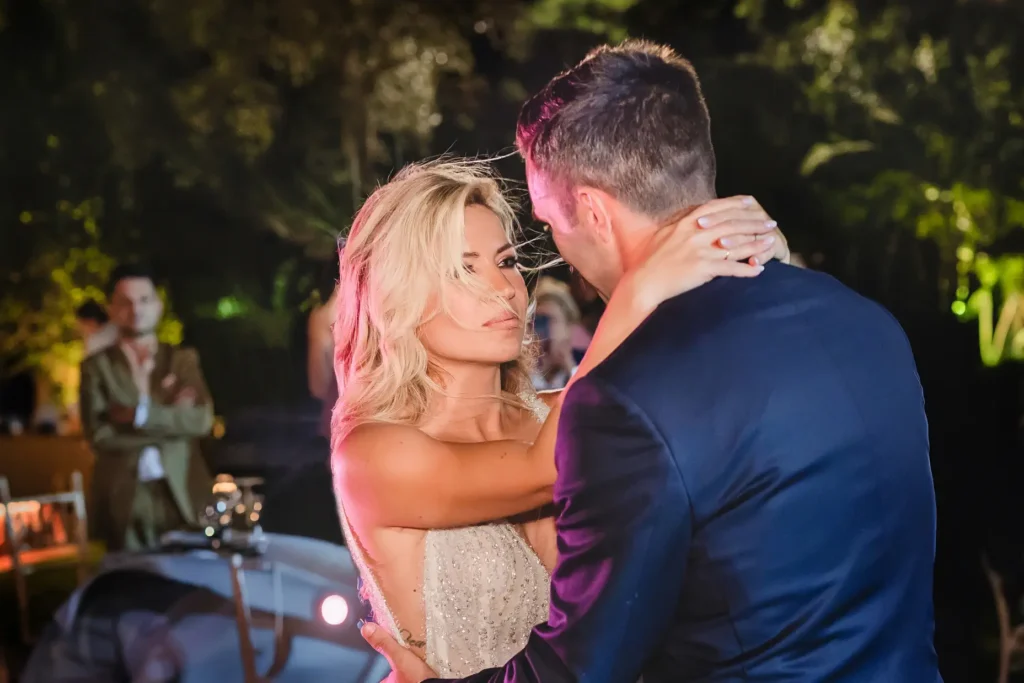 a man and woman dancing at a party