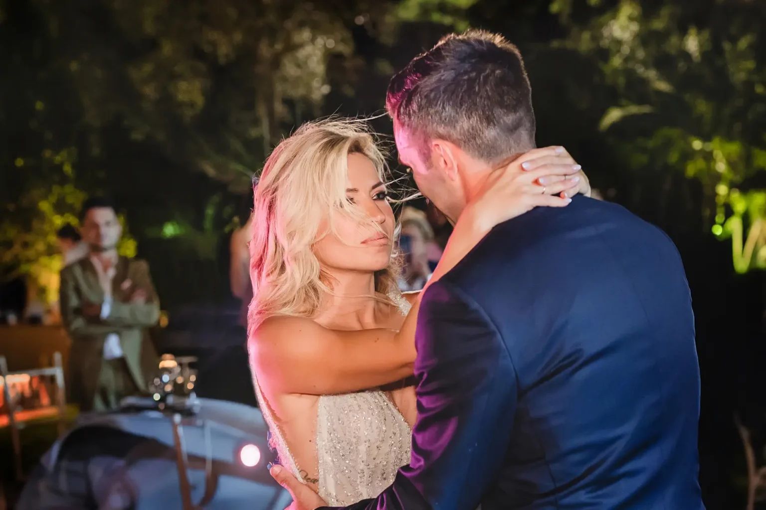 a man and woman dancing at a party