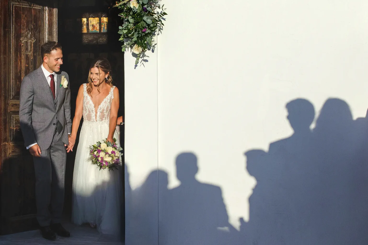 a man and woman in a white dress and suit